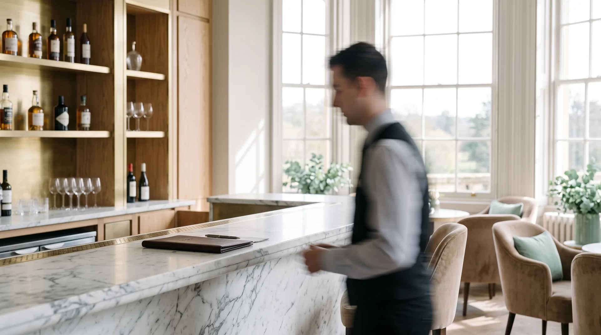 Leather proposal folder on the marble counter of a luxury hotel bar