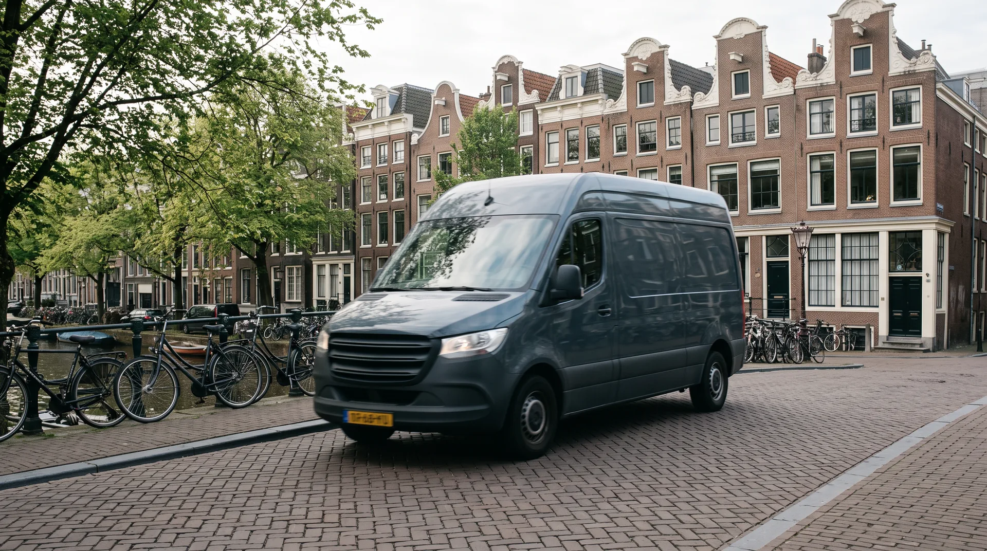 Unbranded delivery van on an Amsterdam canal street